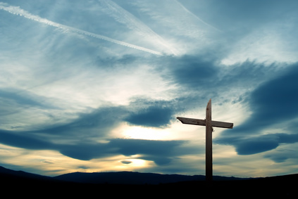 Christian cross over beautiful sky